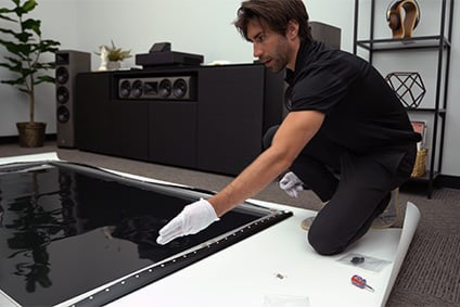 Audio Advice home theater installer assembling the screen that comes with the EPSON LS500 UST 4K projector.