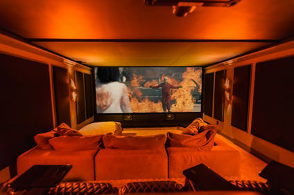 Home Theater with movie on the screen and orange glow