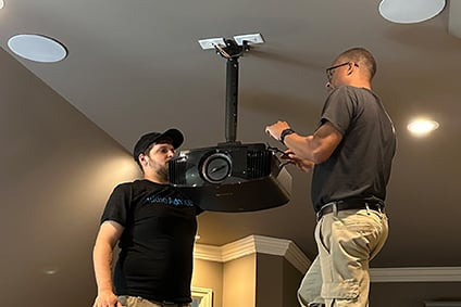 Installers Mounting a Projector
