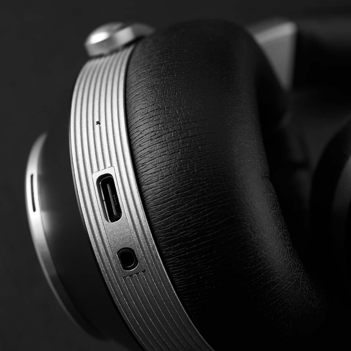 T+A Solitaire T High-Performance Closed-Back Dynamic Headphones - Black - bottom view of single earphone showing USB-C input