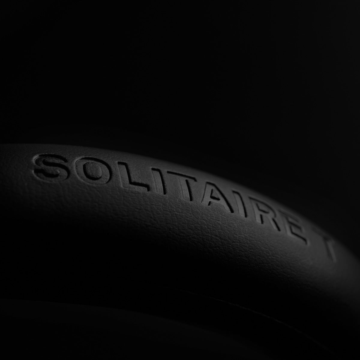 T+A Solitaire T High-Performance Closed-Back Dynamic Headphones - Black - detail of Solitaire T logo on headband