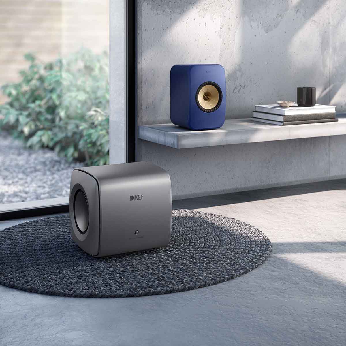 KEF KC62 Subwoofer - Titanium - on floor next to LSXII