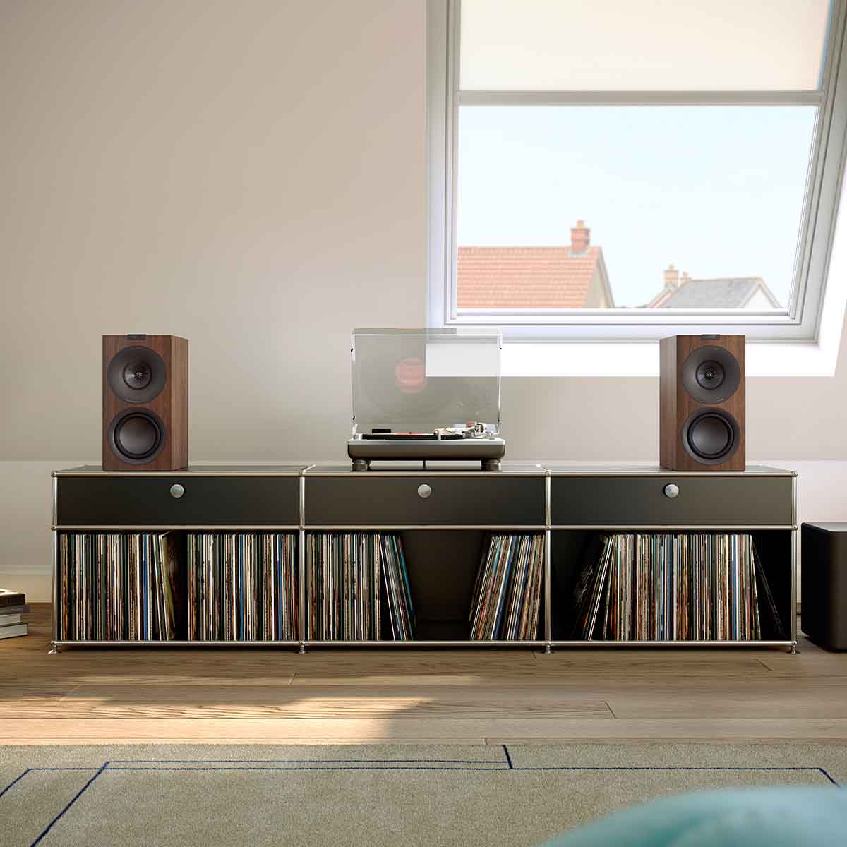 KEF Q Concerto Meta Bookshelf Speakers - Pair front view on media cabinet