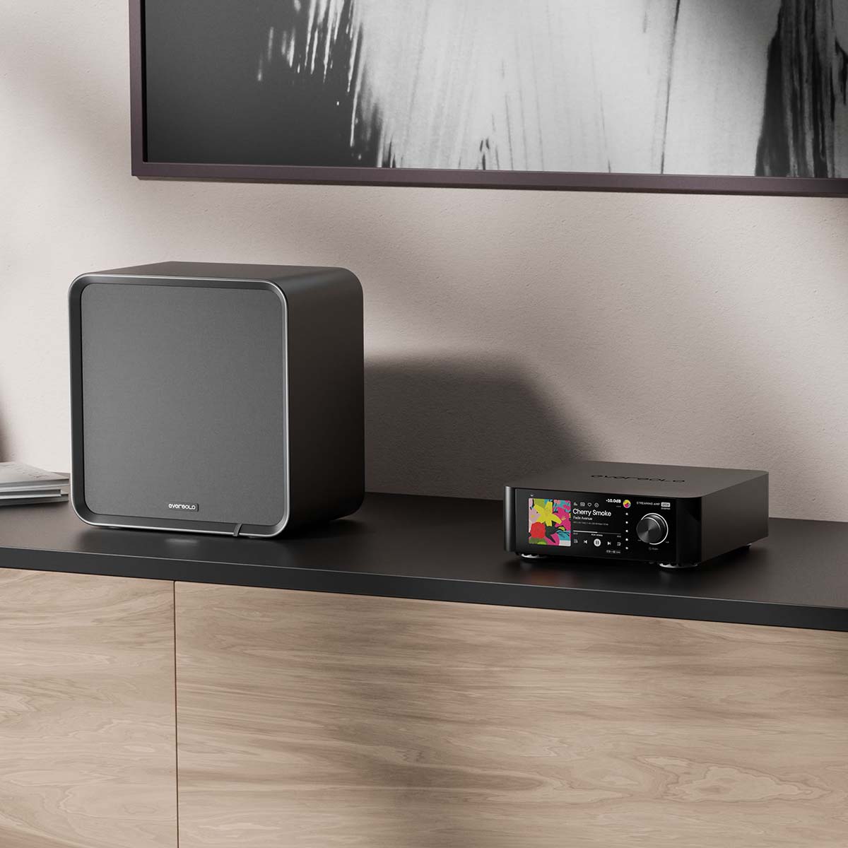 EverSolo SE100 Passive HiFi Bookshelf Speakers - lifestyle photo of single speaker to left on counter with amplifier to right