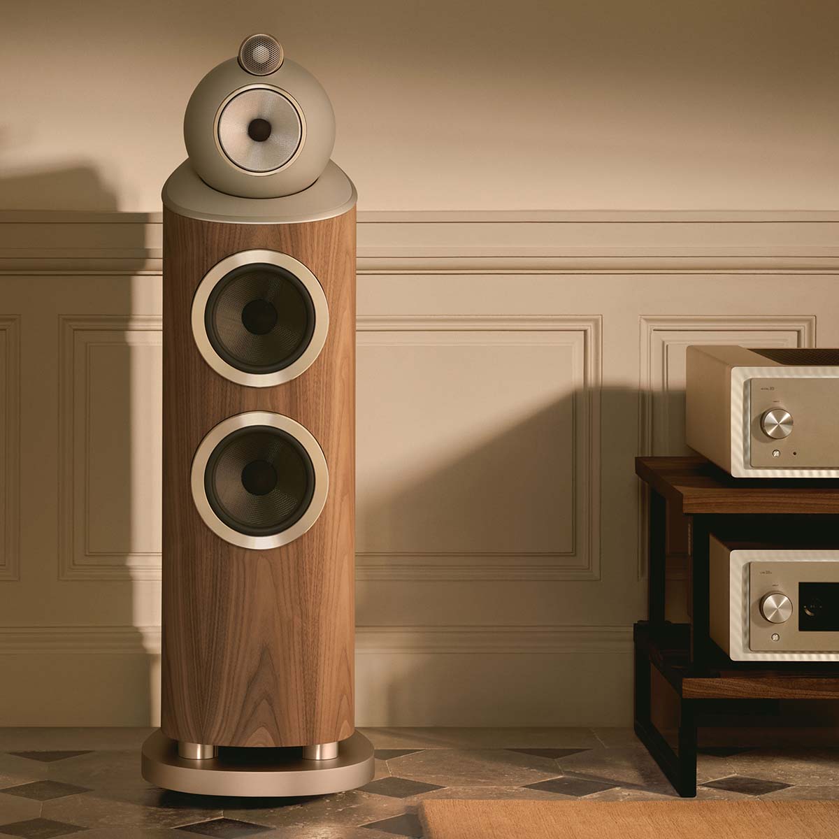 Bowers & Wilkins 803 D5 Floorstanding Loudspeaker - lifestyle photo front view of single Light Walnut speaker without grilles to left of hifi system
