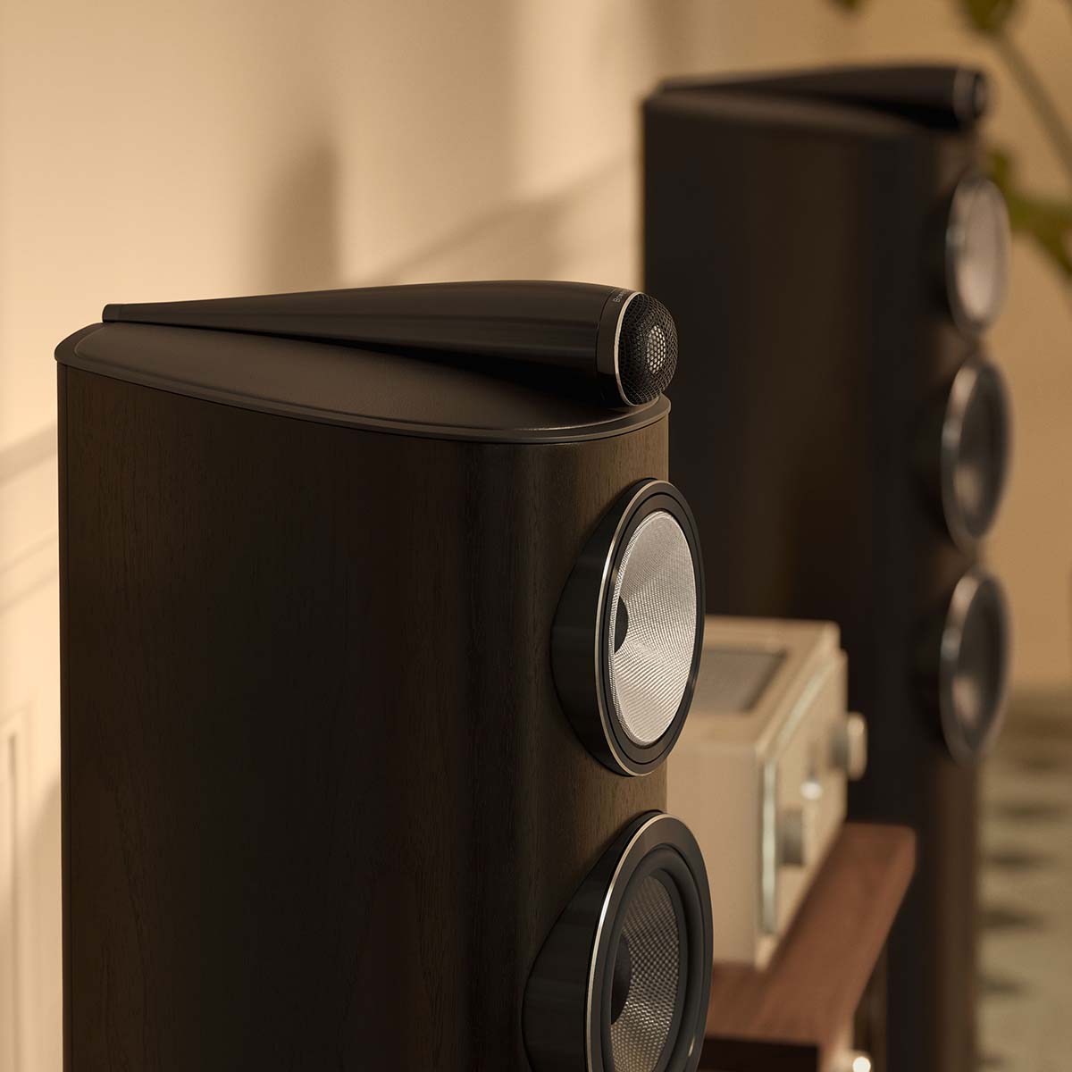 Bowers & Wilkins 804 D5 Floorstanding Loudspeaker - detail lifestyle photo of pair of Dark Walnut speakers facing right in a living room