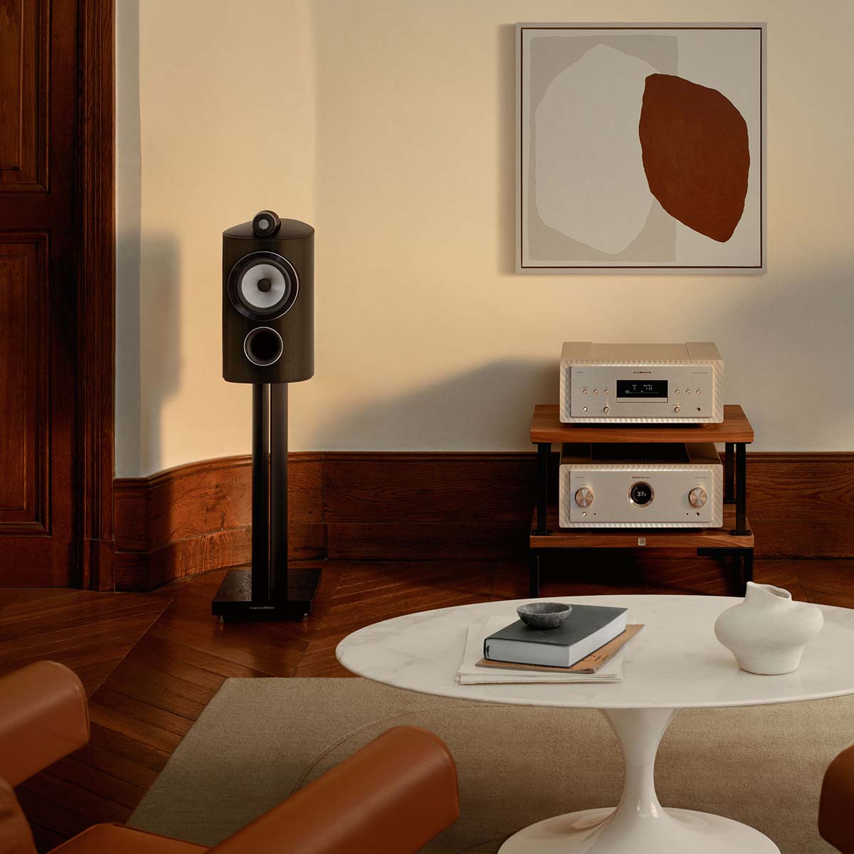 Bowers & Wilkins 805 D5 Bookshelf Loudspeaker - lifestyle photo of single Dark Walnut speaker on stand without grille front view with hifi system to right