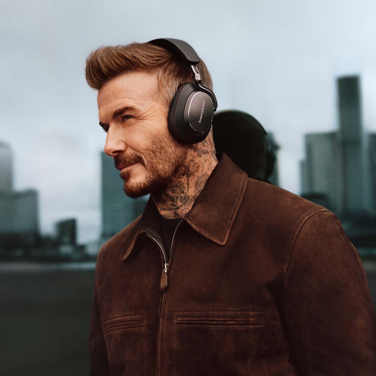 Bowers & Wilkins Px8 S2 Wireless Over-Ear Headphones - Lifestyle photo of David Beckham wearing Black pair
