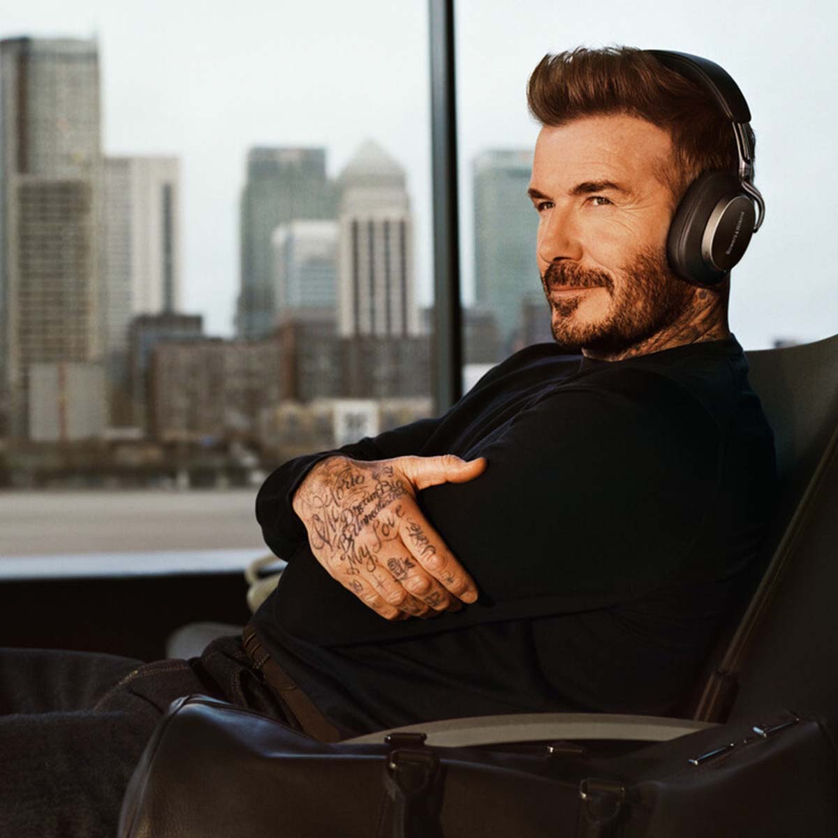 Bowers & Wilkins Px8 S2 Wireless Over-Ear Headphones - Lifestyle photo of David Beckham wearing Black pair