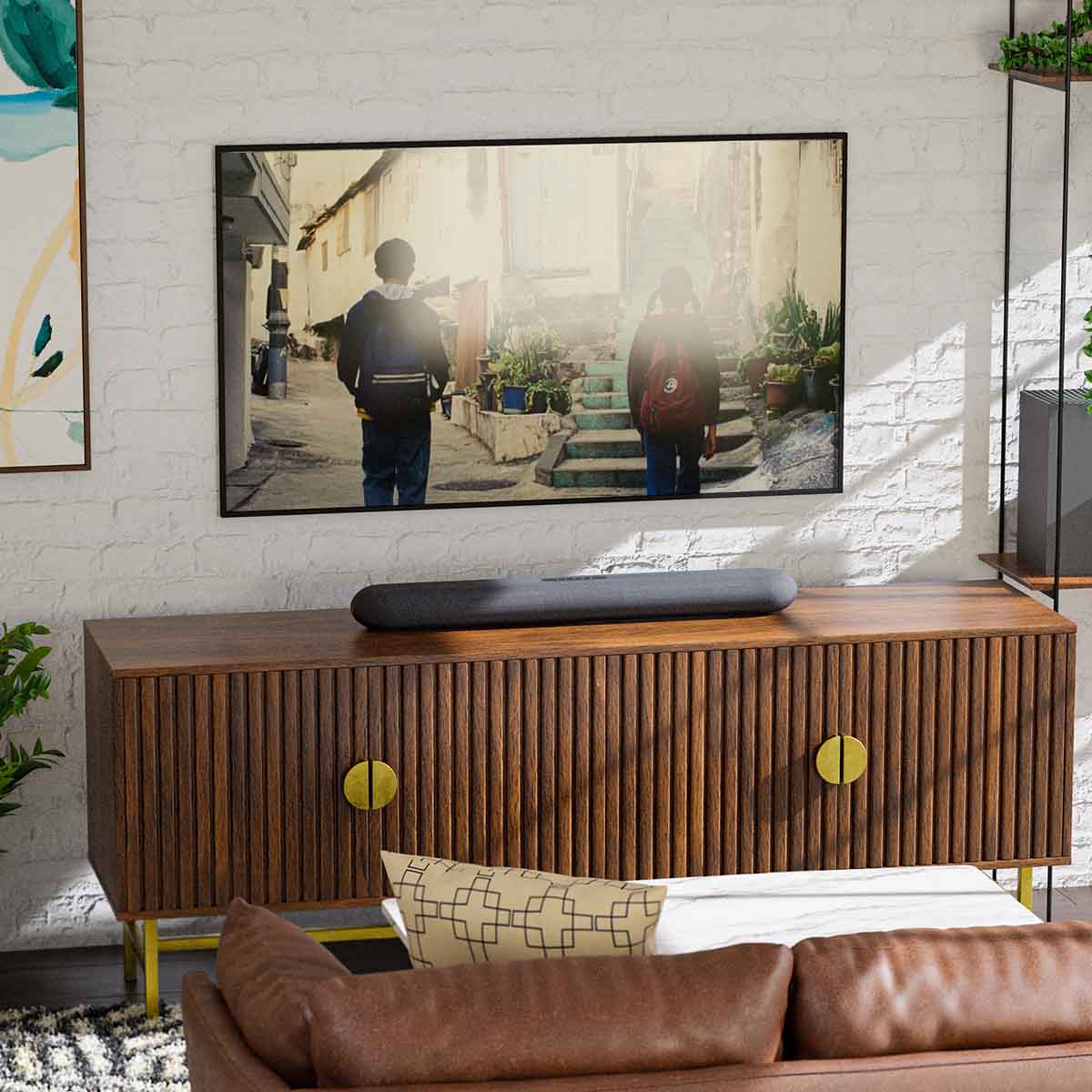 Bluesound Pulse Cinema Mini Multi-Room Streaming Soundbar Black lifestyle photo of unit on cabinet below TV