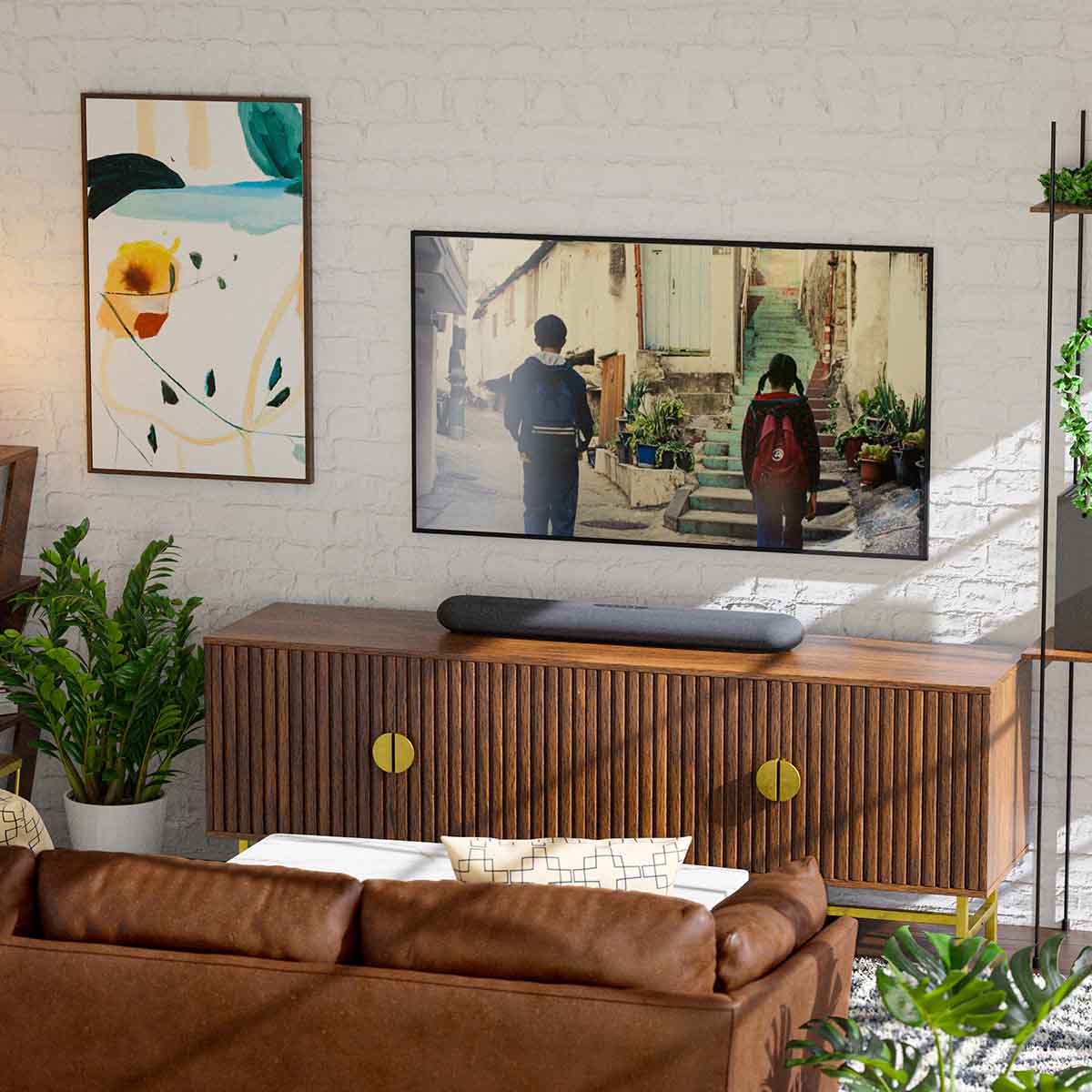 Bluesound Pulse Cinema Mini Multi-Room Streaming Soundbar Black lifestyle photo of unit on cabinet below TV