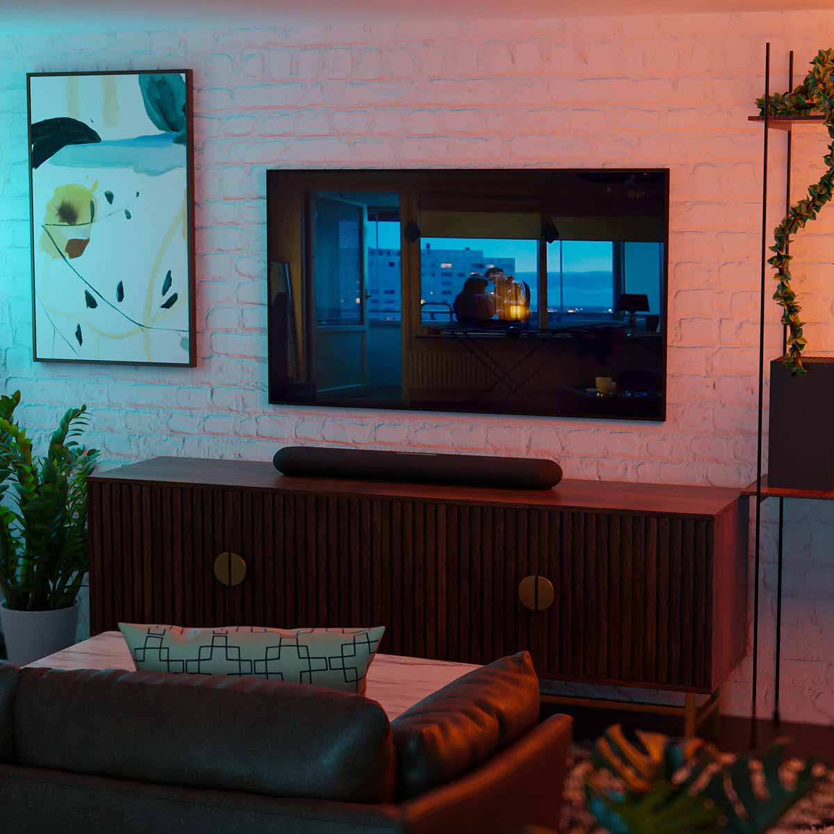 Bluesound Pulse Cinema Mini Multi-Room Streaming Soundbar Black lifestyle photo of unit on cabinet below TV