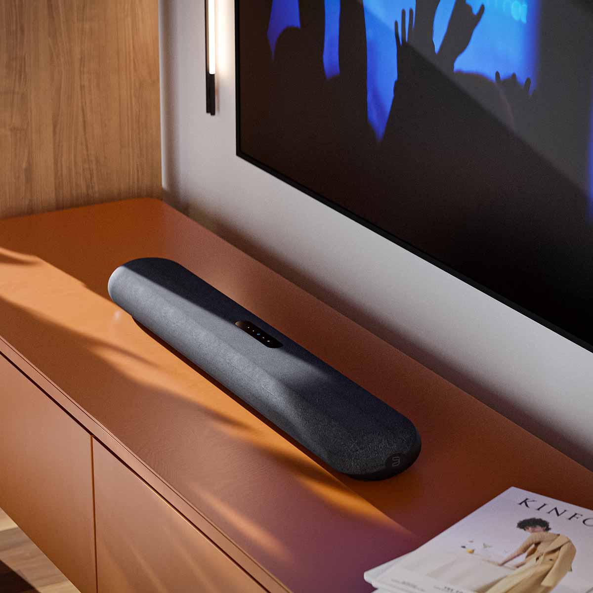 Bluesound Pulse Cinema Mini Multi-Room Streaming Soundbar Black lifestyle photo of unit on cabinet below TV