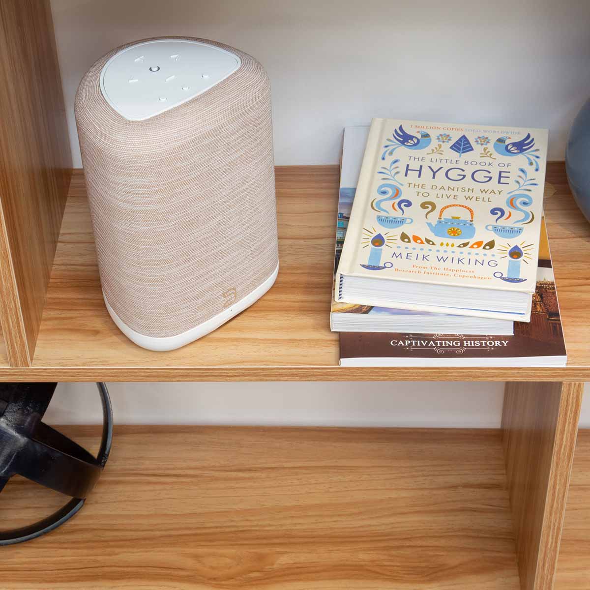 Bluesound Pulse Flex Wireless Multi-Room Music Streaming Speaker - Each - lifestyle photo tan speaker on shelf