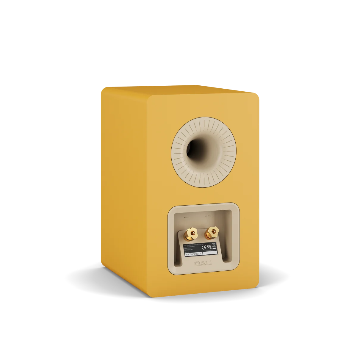 A single DALI KUPID bookshelf speaker in a matte mustard yellow finish, shown from a three-quarter angle on a clean white background.