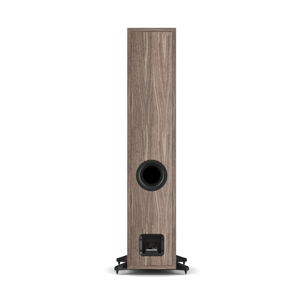 A single tall floor-standing speaker shown from the rear, featuring a wood-grain finish in a medium brown tone with a black circular driver and a small black brand badge near the base, set against a plain white background.