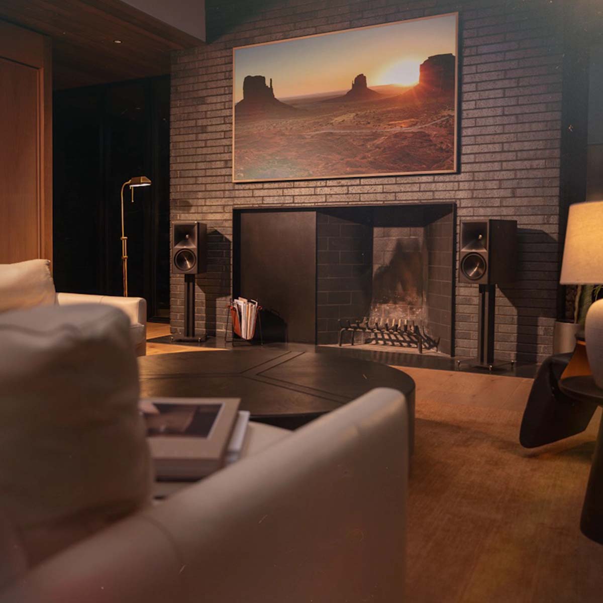 Klipsch The Nines II Dolby Atmos 8" Powered Speakers - Pair - lifestyle photo pair of Ebony speakers on stands on either side of a fireplace in a living room
