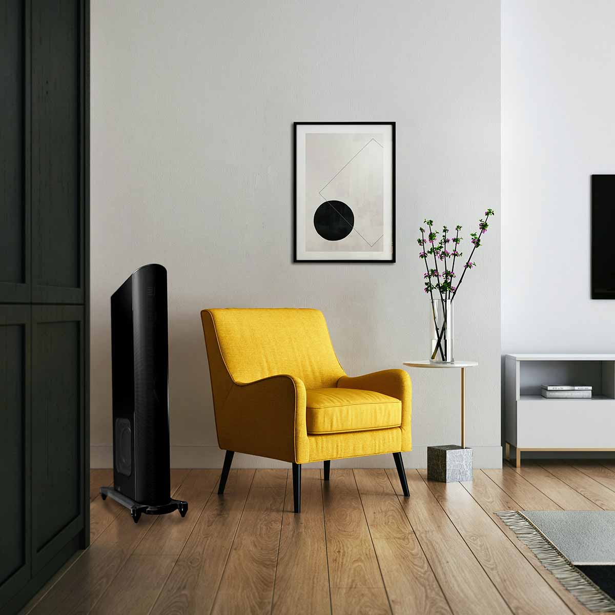 GoldenEar T44 Hybrid Floorstanding Loudspeaker - Piano Black - single speaker lifestyle photo speaker to left of yellow chair