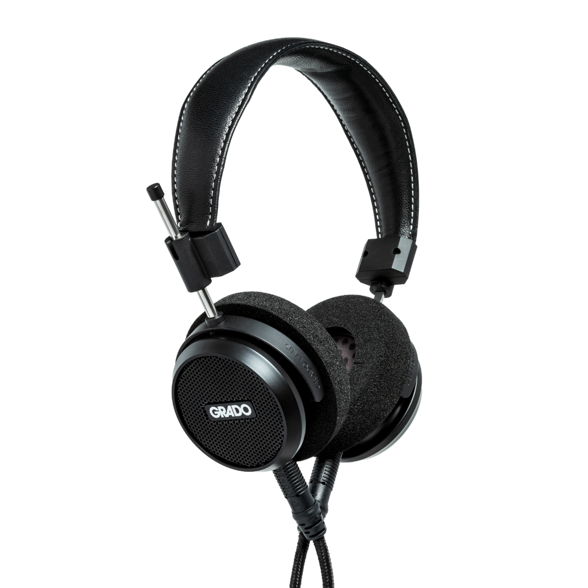 Black over-ear Grado S150 headphones with white contrast stitching on the headband, a flexible boom arm with a built-in microphone, and a cable extending downward. The brand name 'GRADO' is printed in white on the speaker grille.