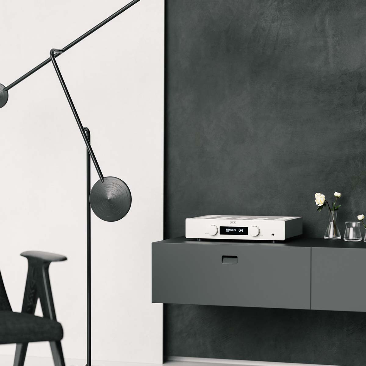 Hegel H120 Integrated Amplifier - white - lifestyle shot of unit in living room on shelf angled left