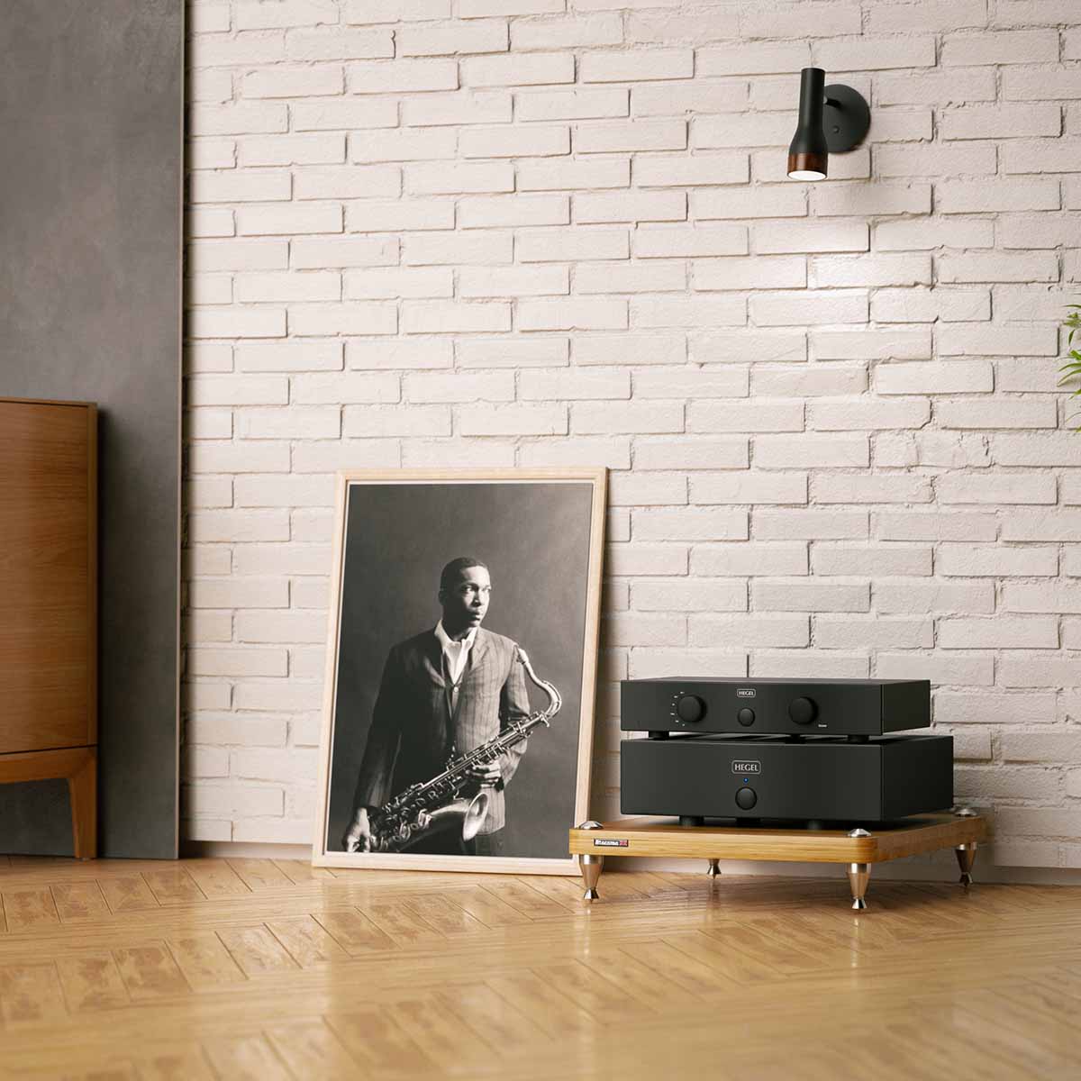 Hegel H20 2-Channel Power Amplifier lifestyle shot stacked on hifi rack in front of brick wall