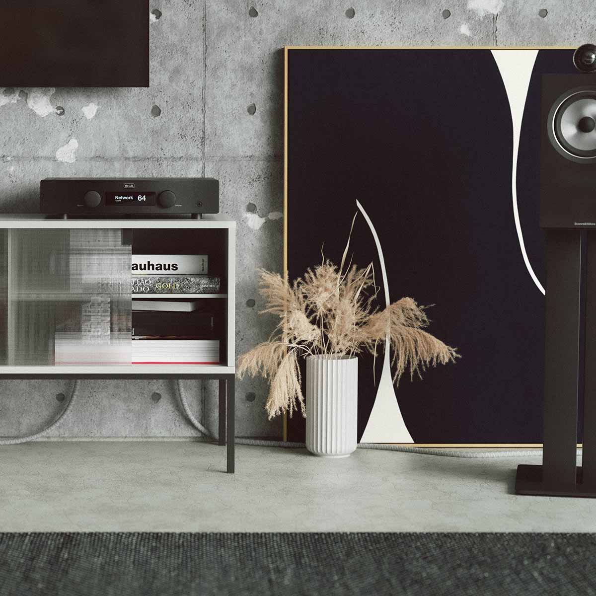 Hegel H95 Integrated Amplifier front view lifestyle shot of unit on cabinet