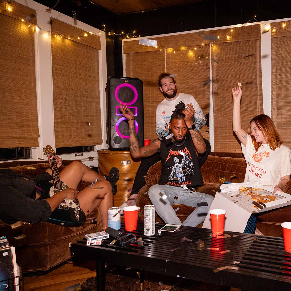 Klipsch New York Music City Series Ultimate Party Speaker lifestyle shot in background with purple lights