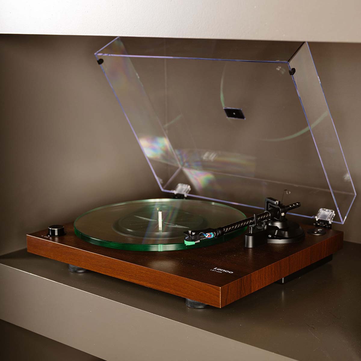 Lenco LBT-225 Bluetooth Turntable w/ Glass Platter and AT-VM95E Cartridge lifestyle shot of unit on shelf with open dustcover and empty platter