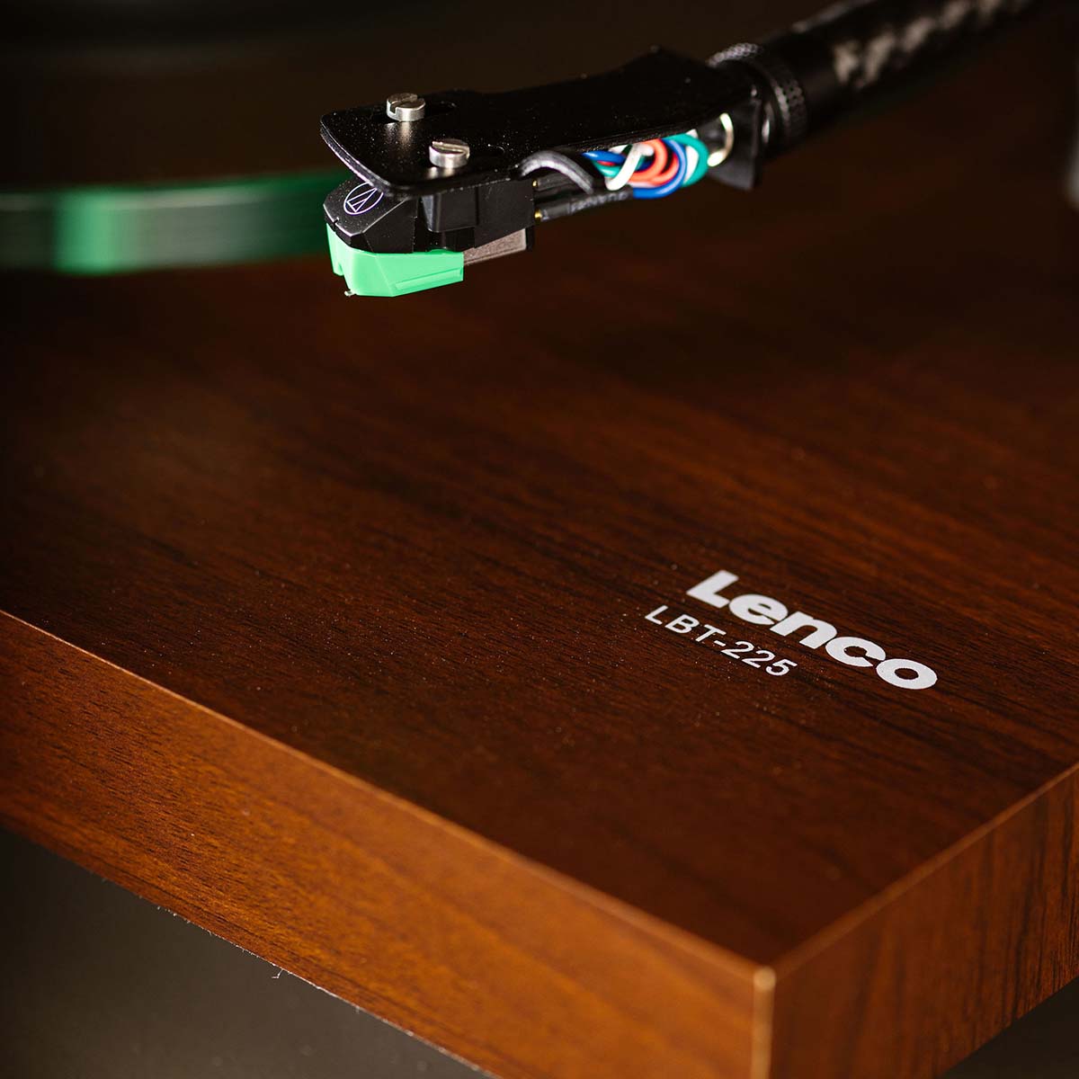 Lenco LBT-225 Bluetooth Turntable w/ Glass Platter and AT-VM95E Cartridge closeup of front right of unit showing Lenco LBT-225 branding and cartridge on tonearm