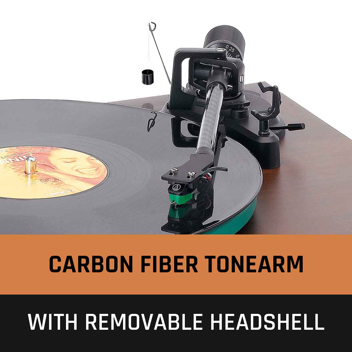 Lenco LBT-225 Bluetooth Turntable w/ Glass Platter and AT-VM95E Cartridge closeup of tonearm engaged on record with text to bottom reading Carbon Fiber Tonearm with Removable Headshell