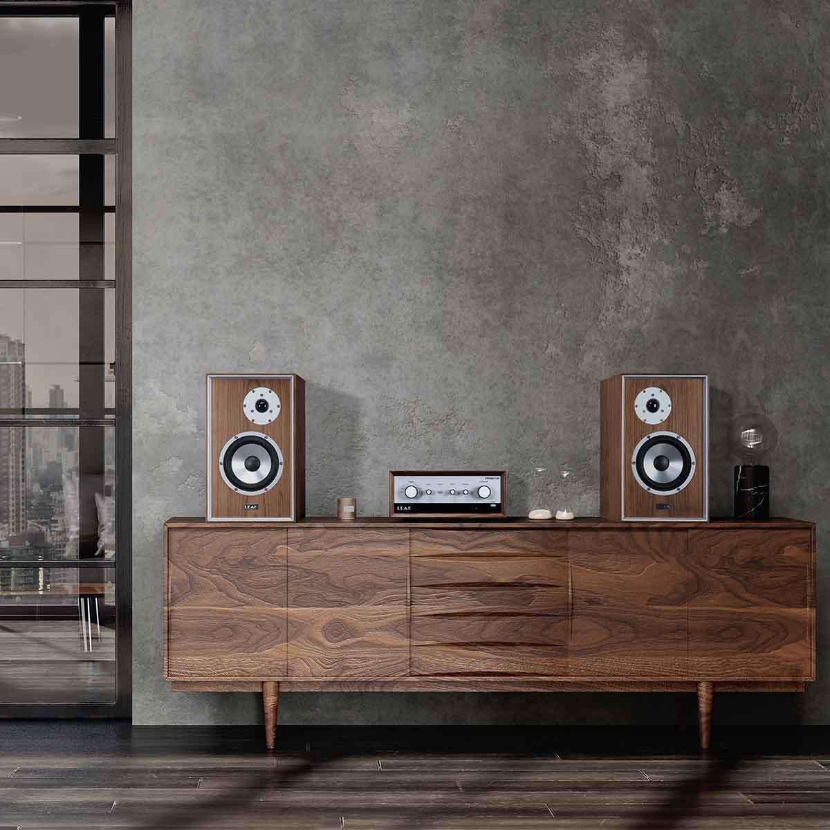 Leak Audio Sandwich 150 Bookshelf Loudspeakers - Walnut - lifestyle shot pair of speakers on cabinet front view without grille