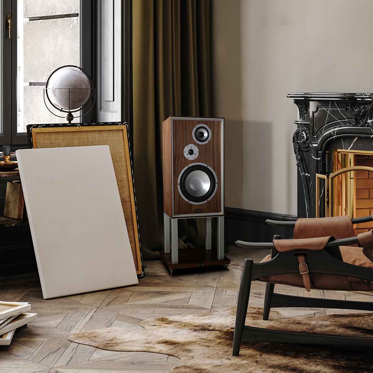 Leak Audio Sandwich 250 Standmount Loudspeakers - Walnut - With Stands - lifestyle shot of single speaker in corner of apartment