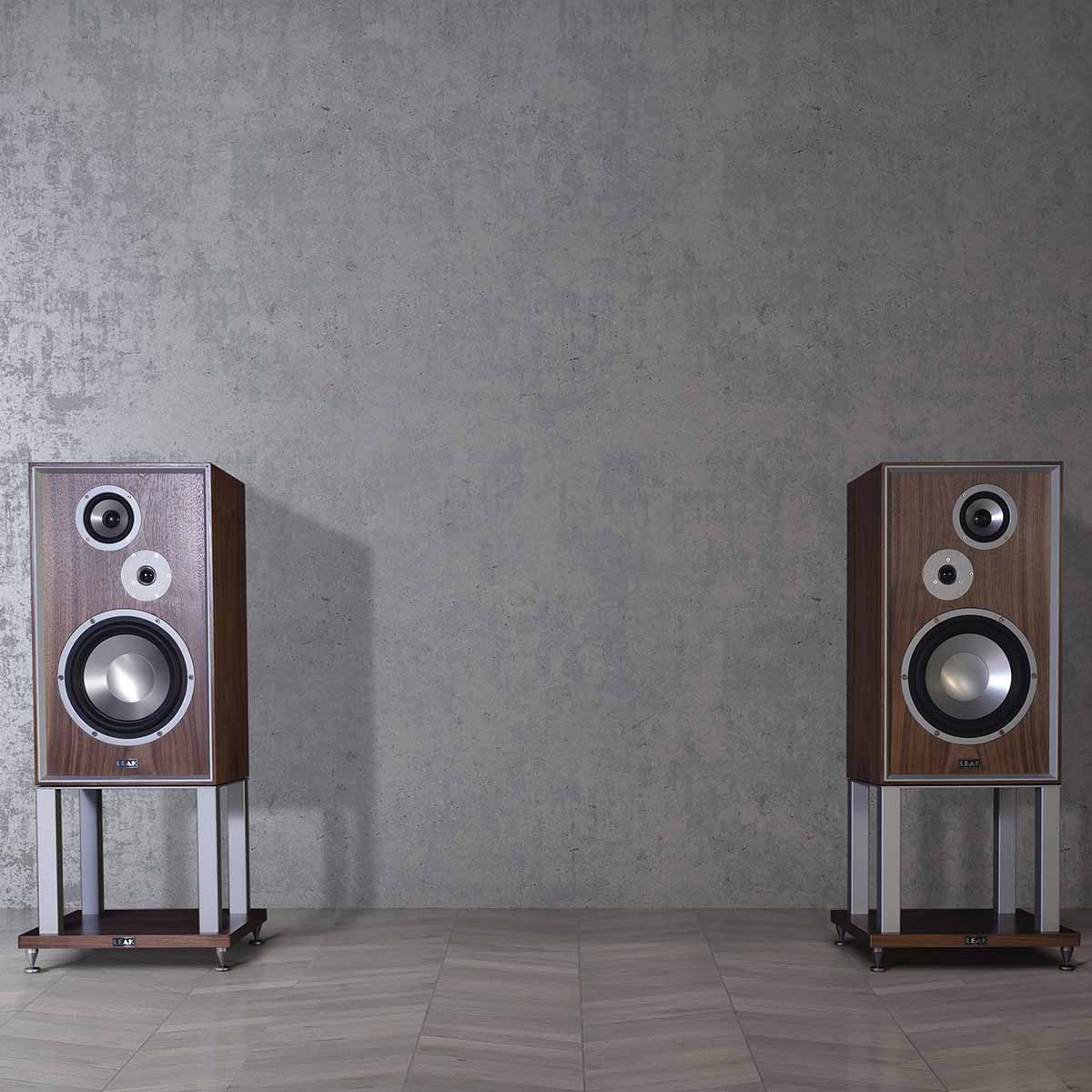 Leak Audio Sandwich 250 Standmount Loudspeakers - Walnut - With Stands - lifestyle shot of pair of speakers without grilles