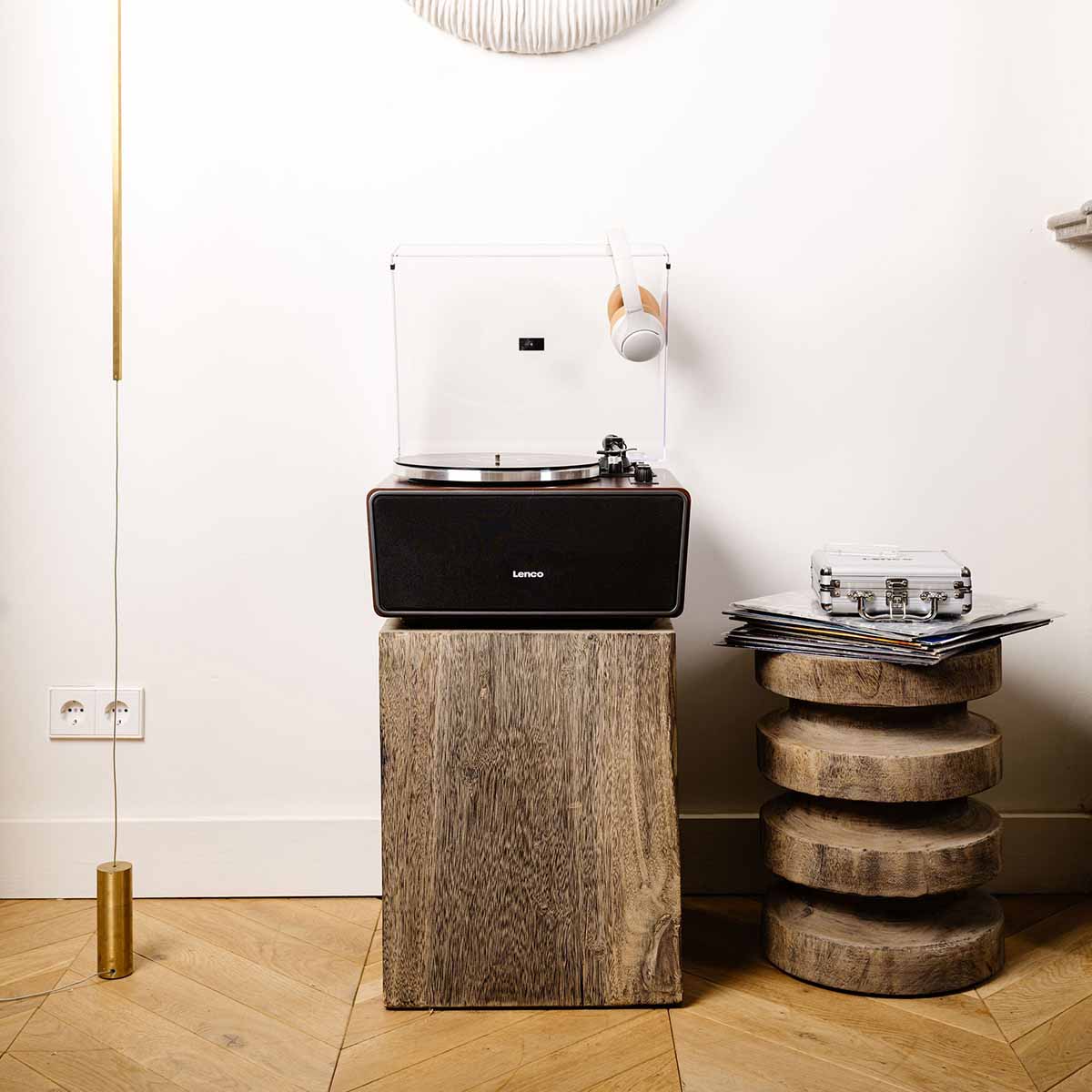 Lenco LS-470 Turntable w/ 80W Speaker System and Bluetooth lifestyle shot front view unit on plinth with headphones hanging on open dustcover