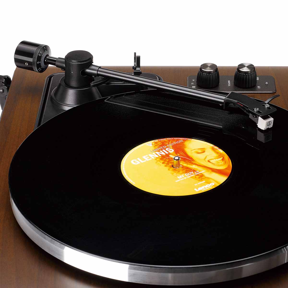 Lenco LS-470 Turntable w/ 80W Speaker System and Bluetooth close-up from left side of unit showing record on platter with engaged tonearm