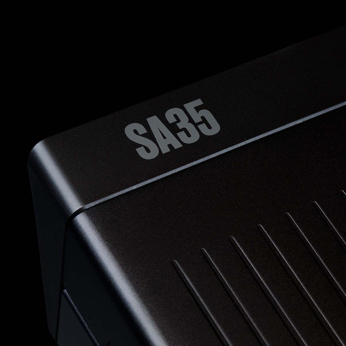 Arcam SA35 Streaming Integrated Amplifier - Black - detail of SA35 logo on black background