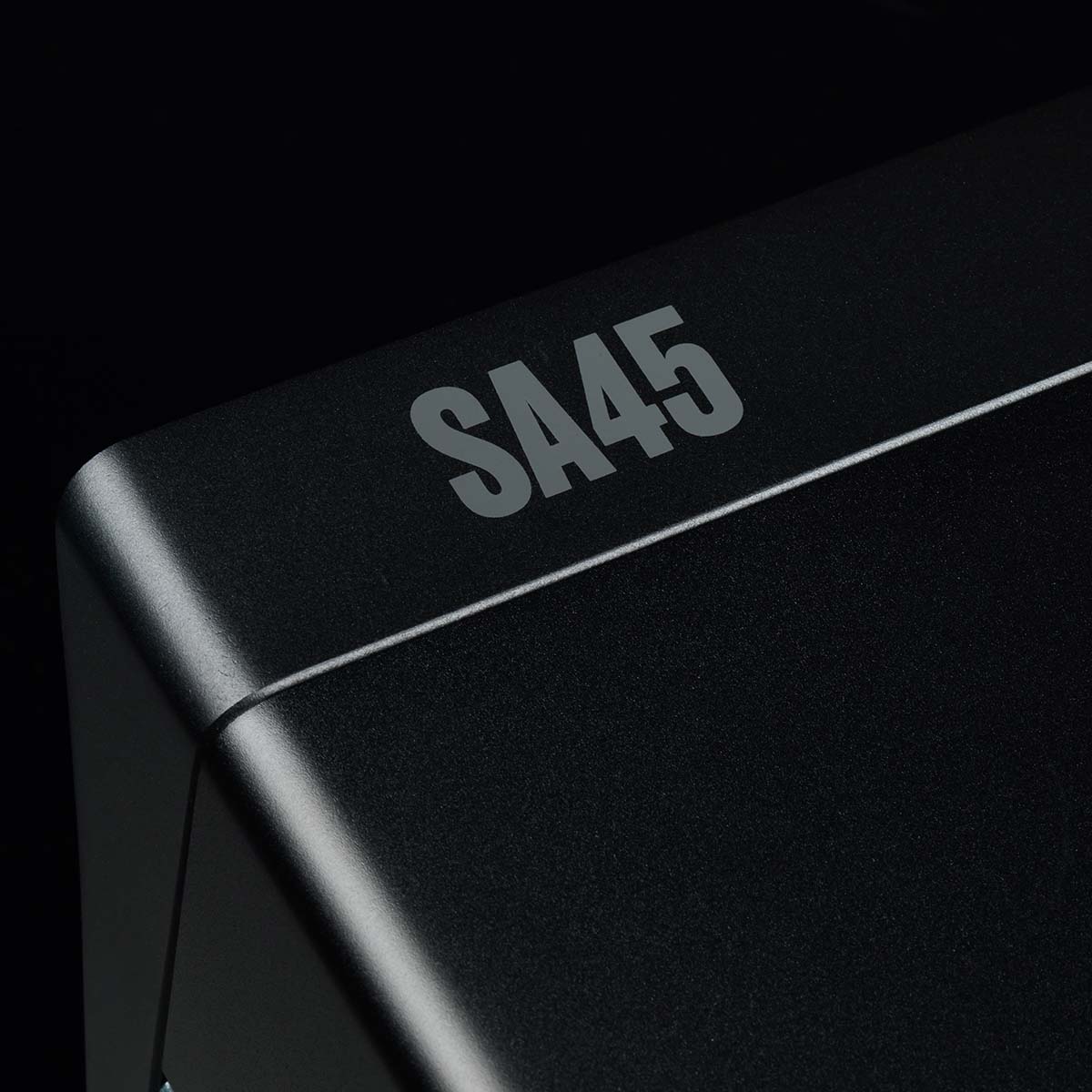 Arcam SA45 Streaming Integrated Amplifier - Black - detail of SA45 logo on black background