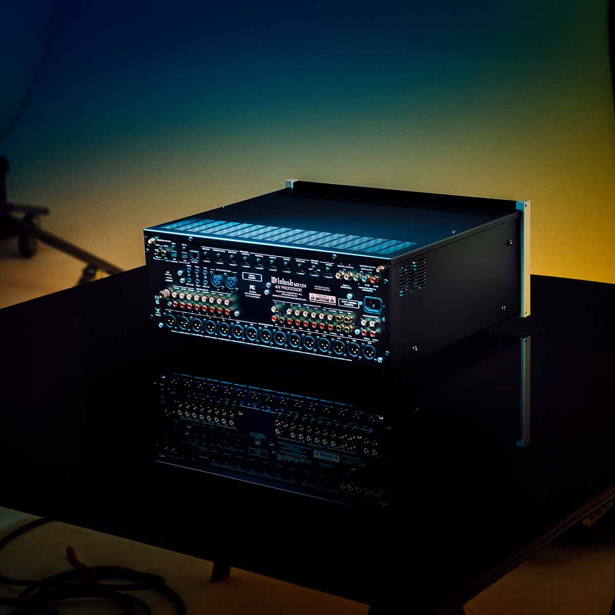 McIntosh MX124 A/V Processor editorial photo rear view angled left with unit lit