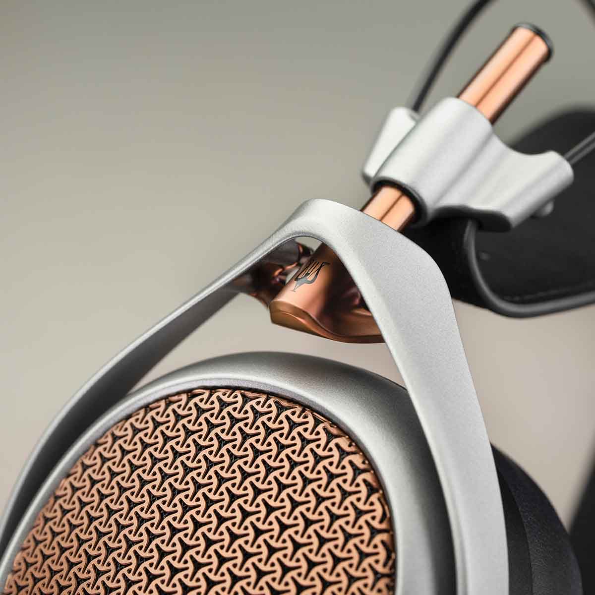 Meze Audio Poet High-Performance Planar-Magnetic Headphones detail of Meze logo on side angled left