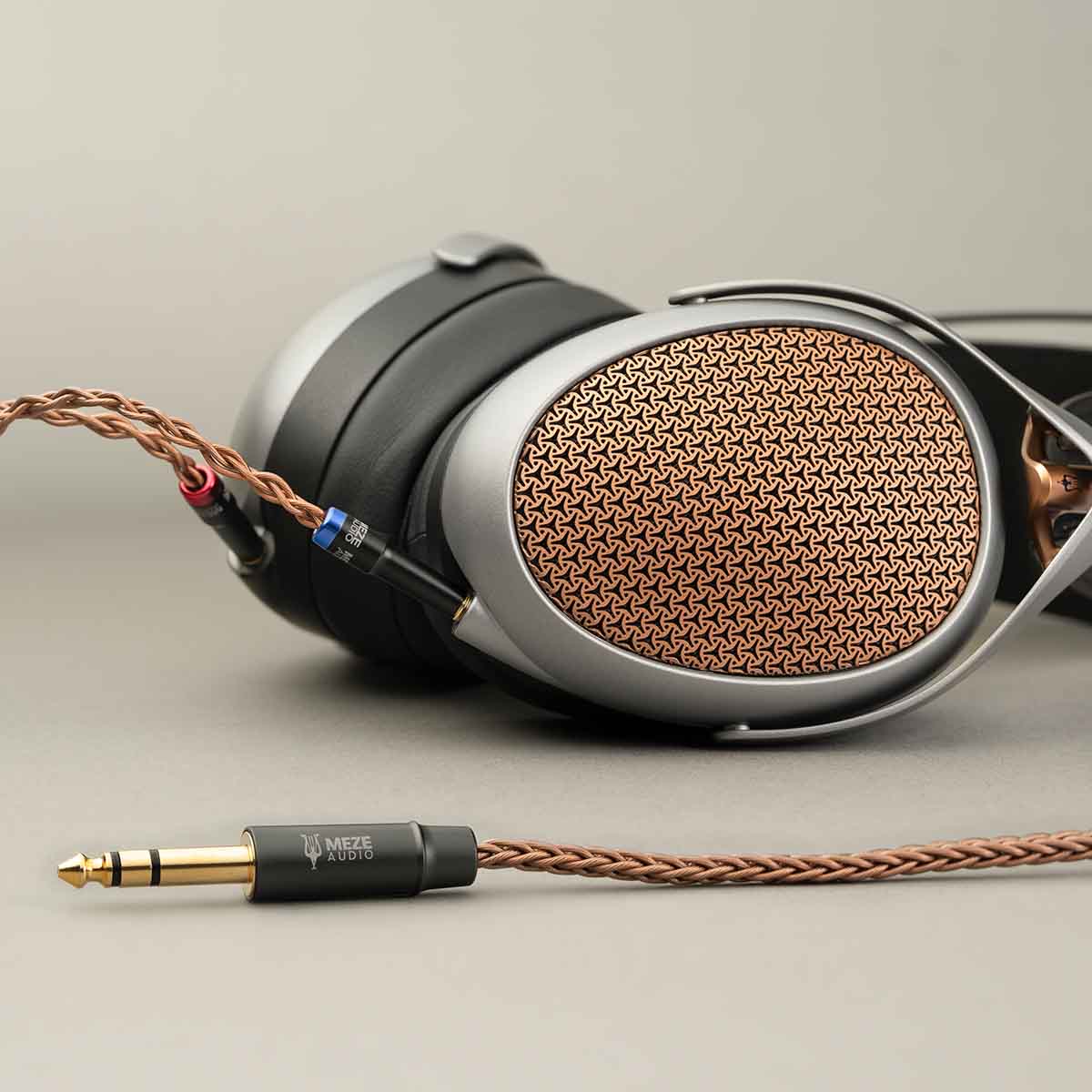 Meze Audio Poet High-Performance Planar-Magnetic Headphones side view laying flat with attached cable