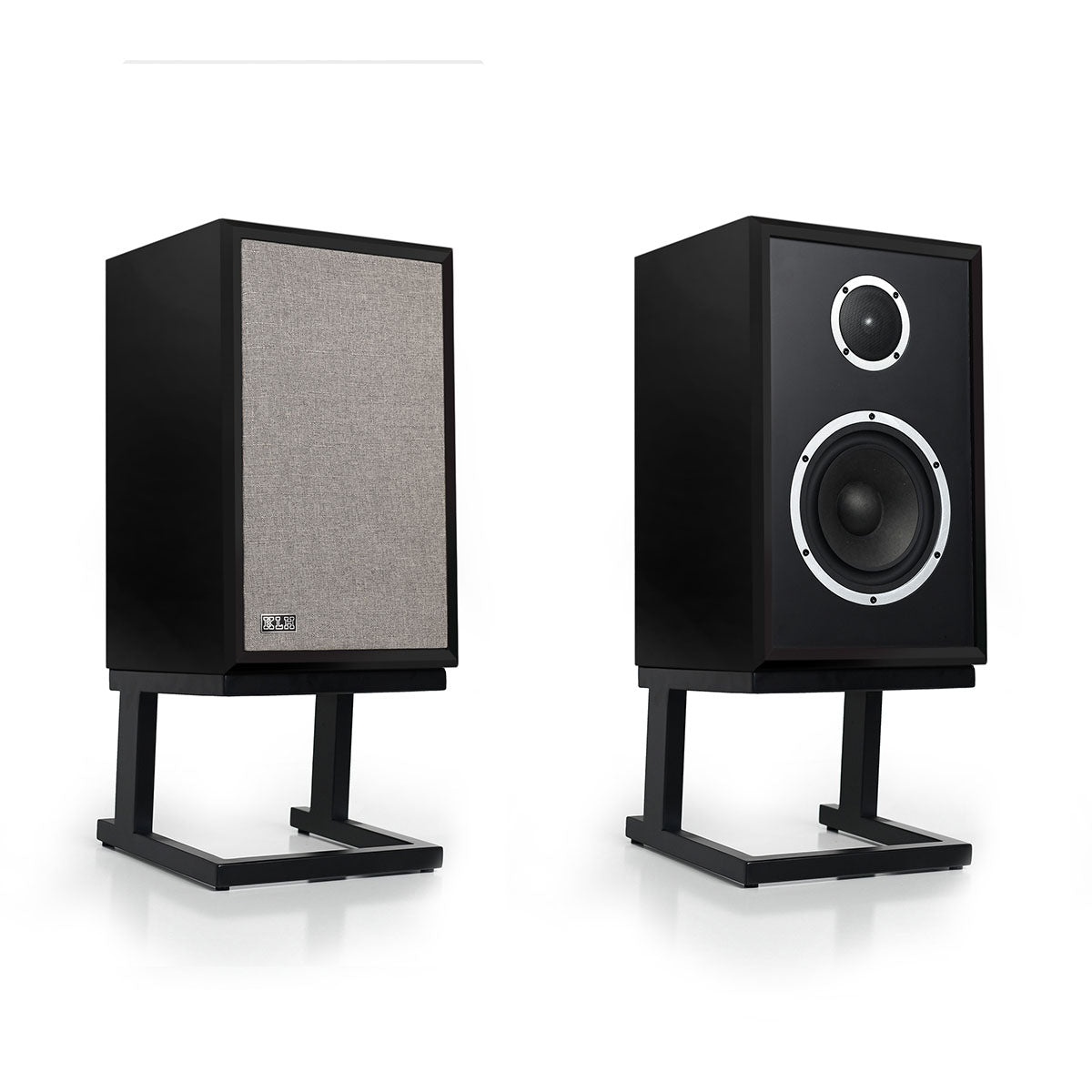 KLH Model Three Acoustic Suspension Loudspeakers - pair of black speakers both angled right, left speaker with grille, right speaker without grille