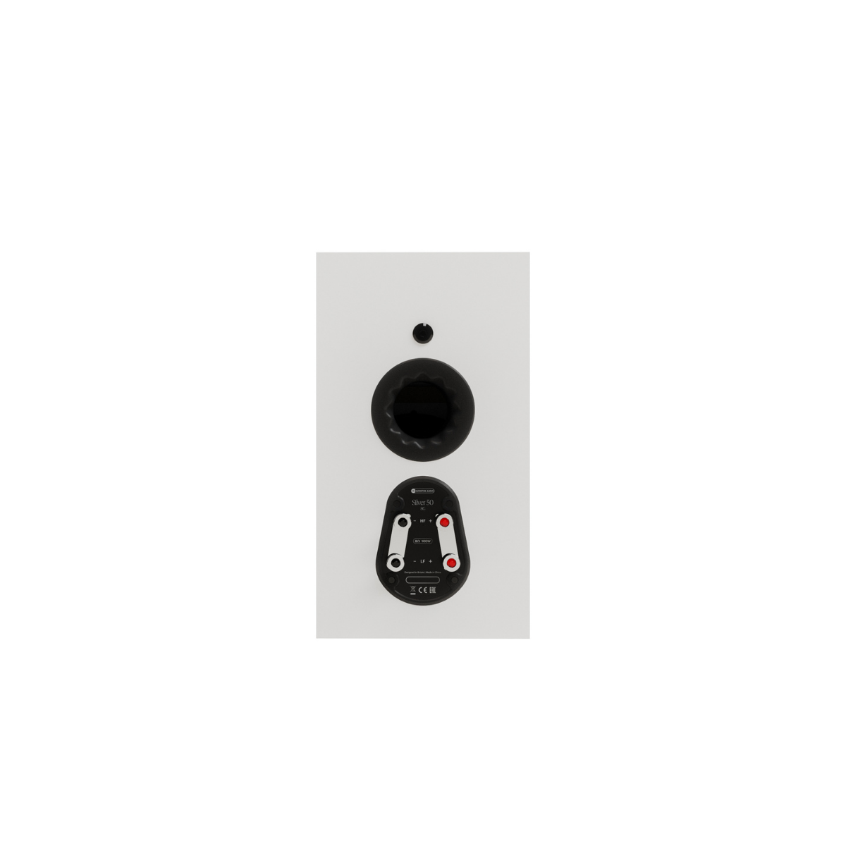 A close-up of a Monitor Audio Silver 50 8G Compact 2-way Bookshelf Speaker showing the rear connection area with a black circular port and a black terminal cover with red and white screw terminals.