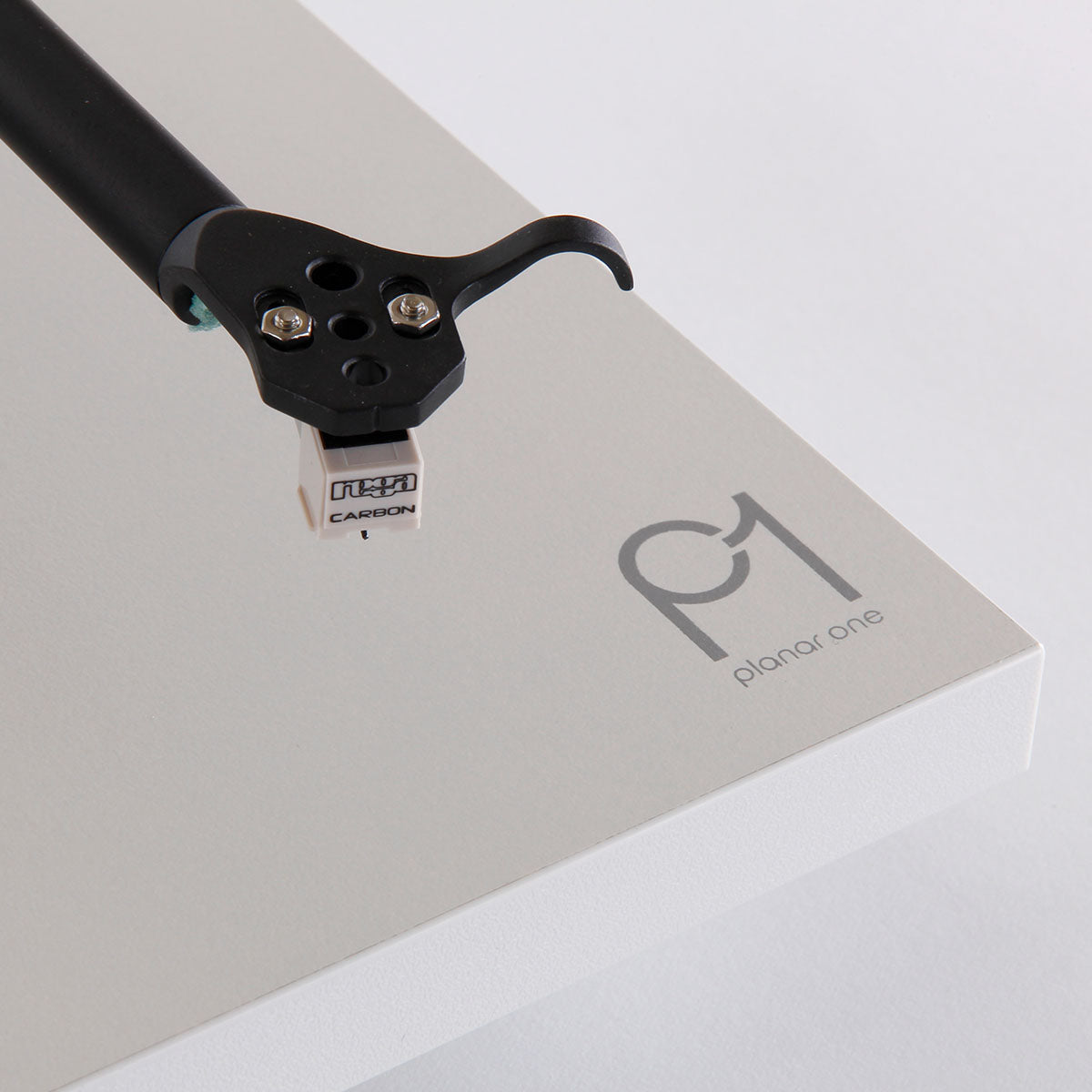 Rega Planar 1 Turntable - white - top down view of Planar 1 logo and Carbon cartridge at end of tone arm