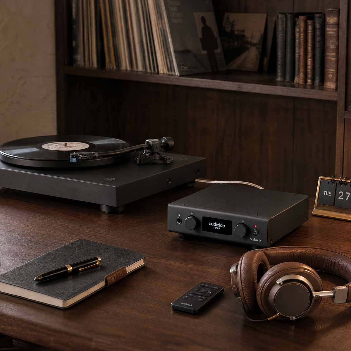 Audiolab PPA7 Phono Preamplifier - Black - lifestyle photo of unit on desk to right of turntable