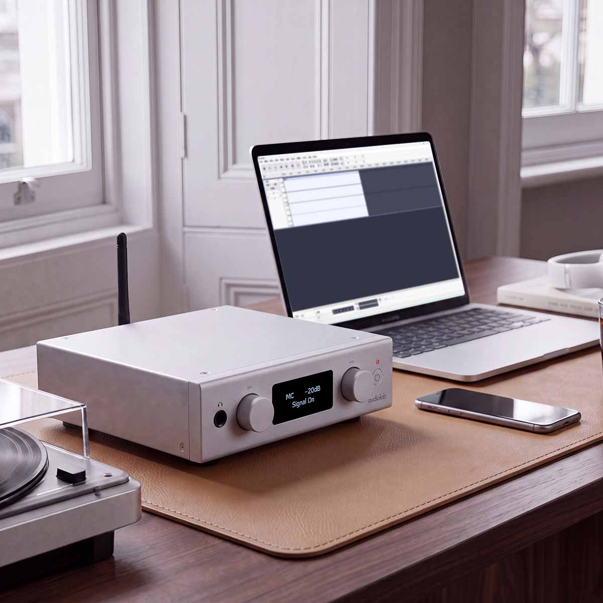 Audiolab PPA7 Phono Preamplifier - Silver - lifestyle photo of unit on desk to left of laptop
