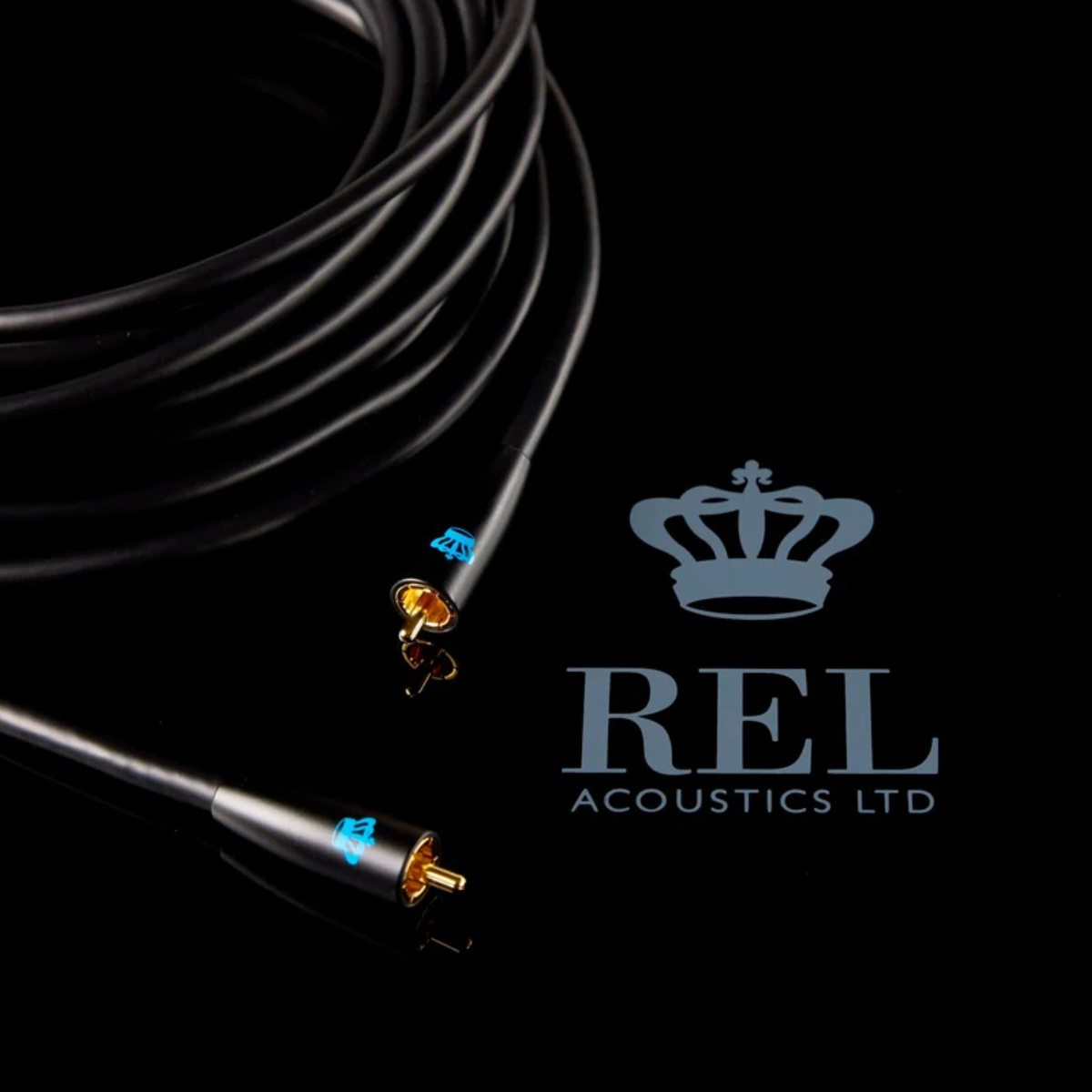A coiled black audio cable with gold-plated RCA connectors and blue REL logo markings, displayed on a black background next to the REL Acoustics Ltd logo.