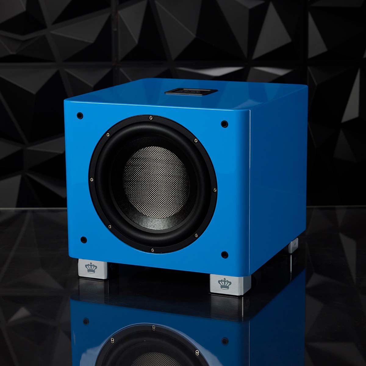 REL Acoustics T/9x SE Subwoofer Blue unit without grille in front of black textured background angled left