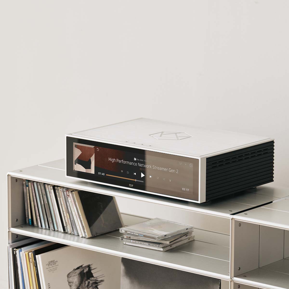 HiFi Rose RS151 High Performance Network Streamer Gen 2 - Silver - top and front view angled left lifestyle shot of unit on record shelf