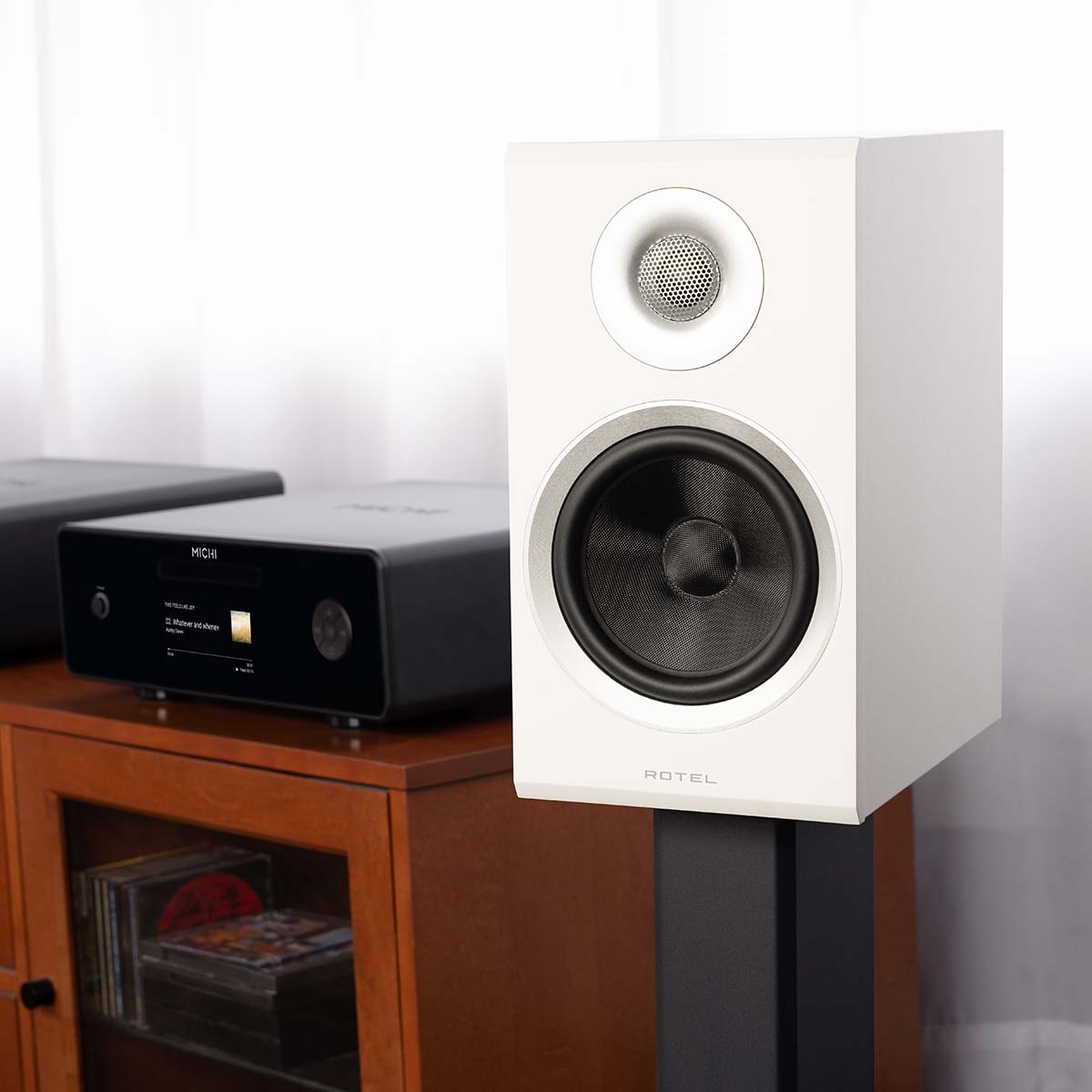 Rotel Amora 5 Passive Bookshelf Loudspeakers - White - Lifestyle photo front and side view angled left without grille
