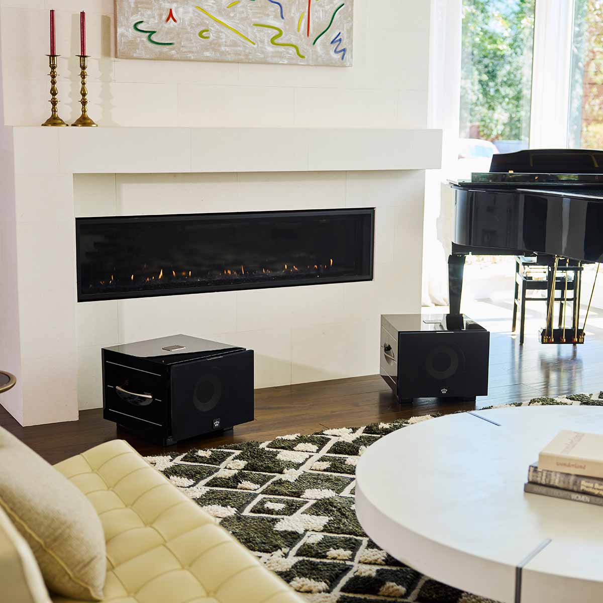 REL Acoustics S/550 Subwoofer - black - lifestyle photo two subwoofers to either side of fireplace with grilles